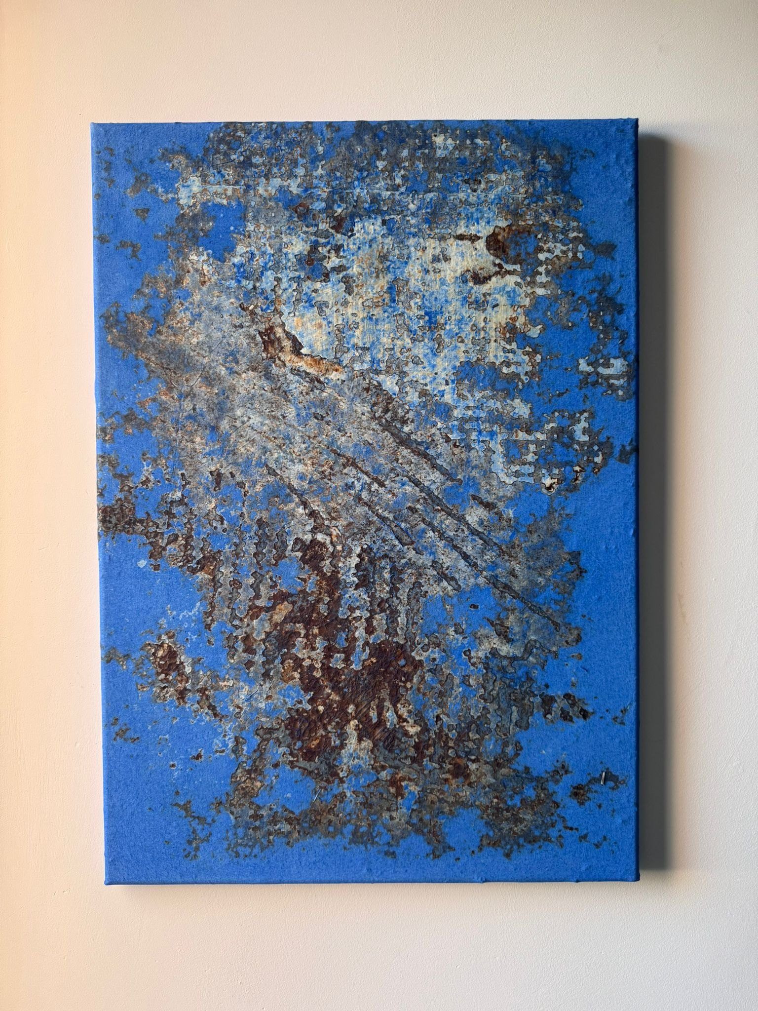 Collaboration Series work in deep blue over a grown mycelium relief