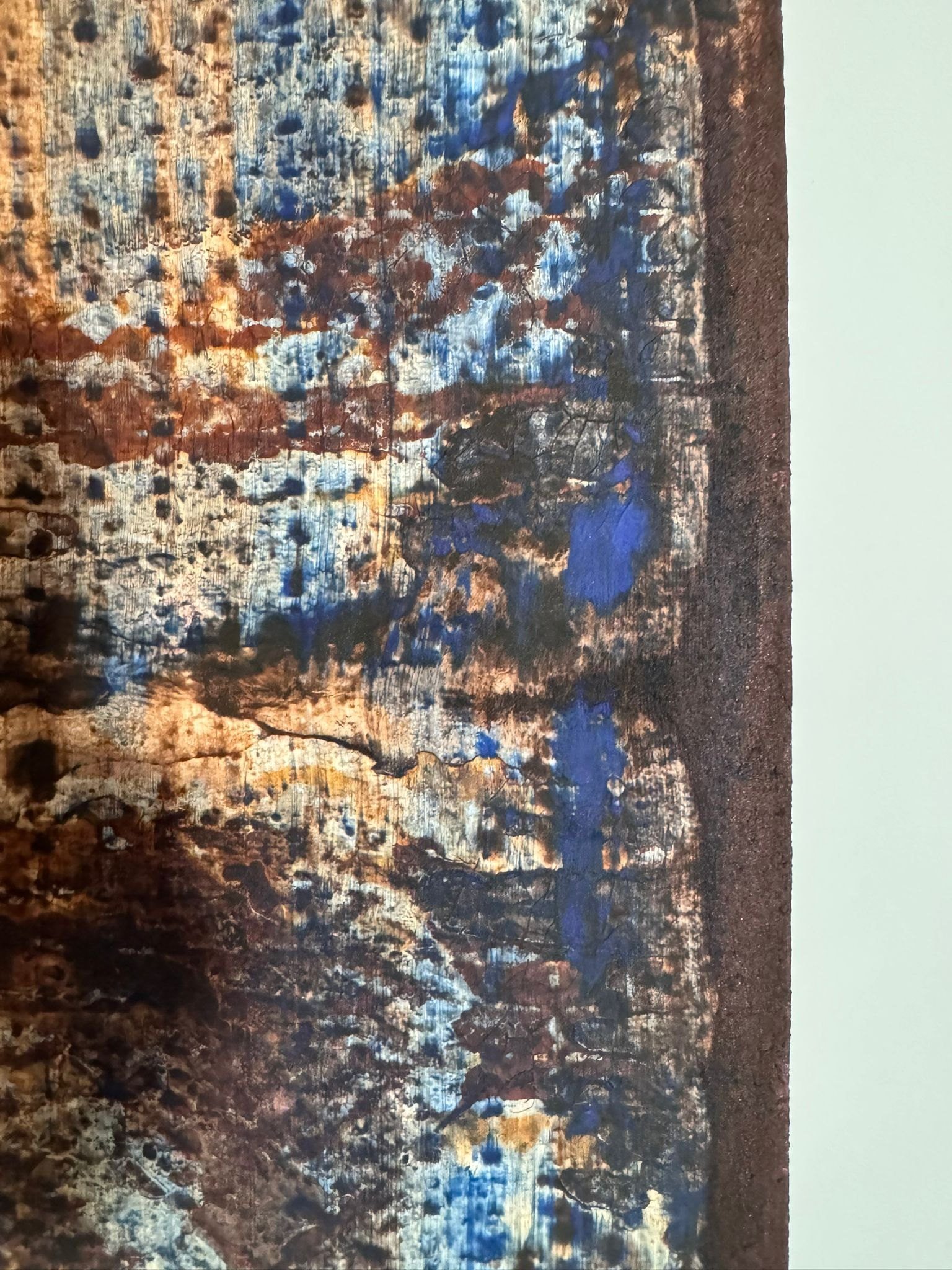 Detail of a Collaboration Series work: blue paint and rust over grown relief